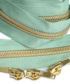 1 m Reissverschluss 6.5 mm mit 4 Schiebern in gold - mint / gold